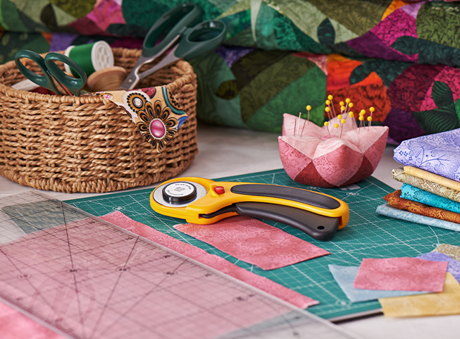 Fabric crafting tools and materials on a desk