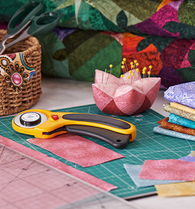 Fabric crafting tools and materials on a desk